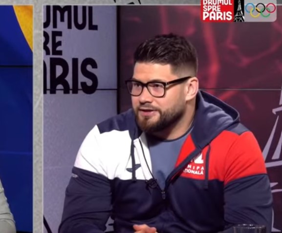 Luptătorul Alin Alexuc-Ciurariu dezvăluie secretul deplasărilor în străinătate: „Nu am concurenți la categoria mea de 130 de kilograme, nu există grei în România” | VIDEO EXCLUSIV DRUMUL SPRE PARIS